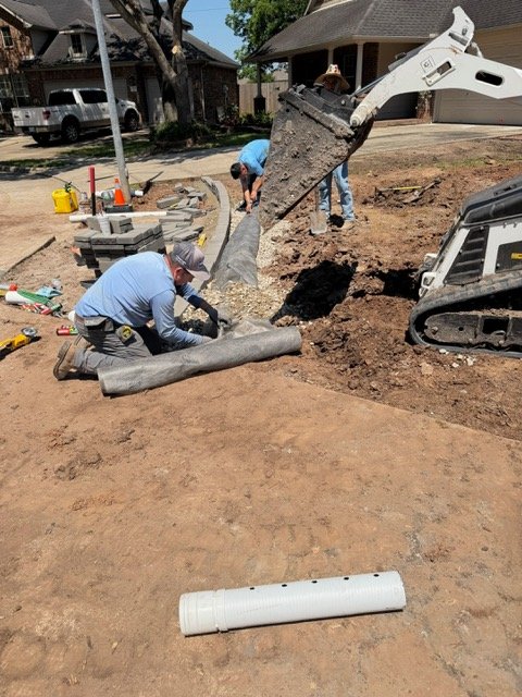 Apex crew installing drainage fabric and aggregate